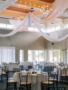 White and green florals with candles at wedding reception at a Channel Side Wedding in Palm Coast, Florida. Taken by Ashley Dye Photography, a Jacksonville, Florida Wedding Photographer.