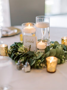 White and green florals with candles at wedding reception at a Channel Side Wedding in Palm Coast, Florida. Taken by Ashley Dye Photography, a Jacksonville, Florida Wedding Photographer.