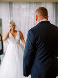 Bride approaches father for first look at her Channel Side Wedding in Palm Coast, Florida. Taken by Ashley Dye Photography, a Jacksonville, Florida Wedding Photographer.